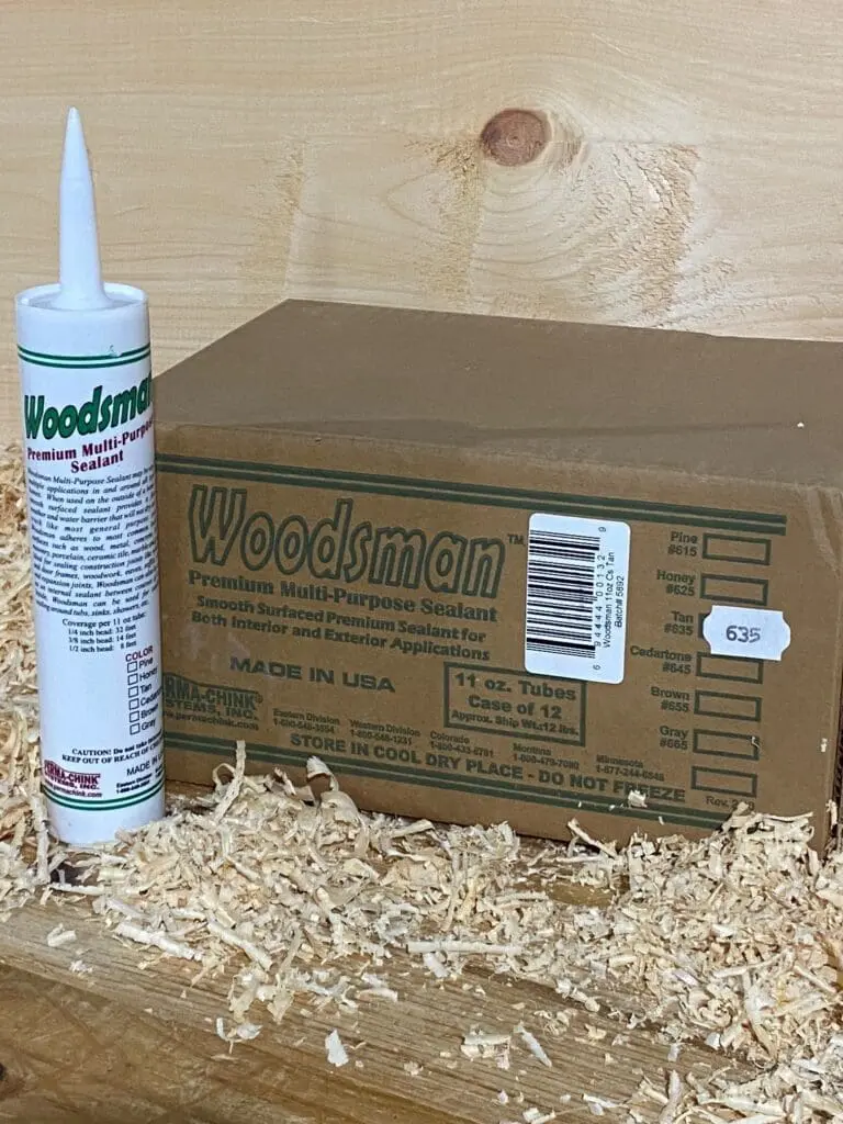 Woodsman sealant tube and box on shavings.